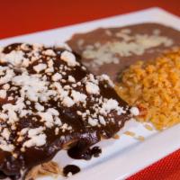 Enchiladas Mix · Two enchiladas. Topped with enchiladas sauce. Served with rice & beans. With shredded chicke...