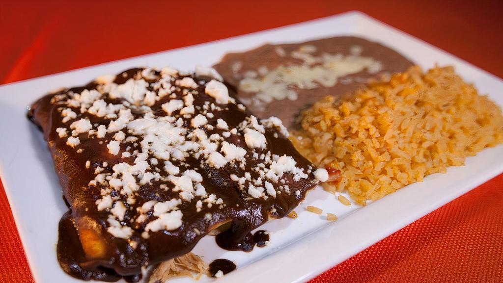 Enchiladas Mix · Two enchiladas. Topped with enchiladas sauce. Served with rice & beans. With shredded chicken, ground beef, cheese or spinach