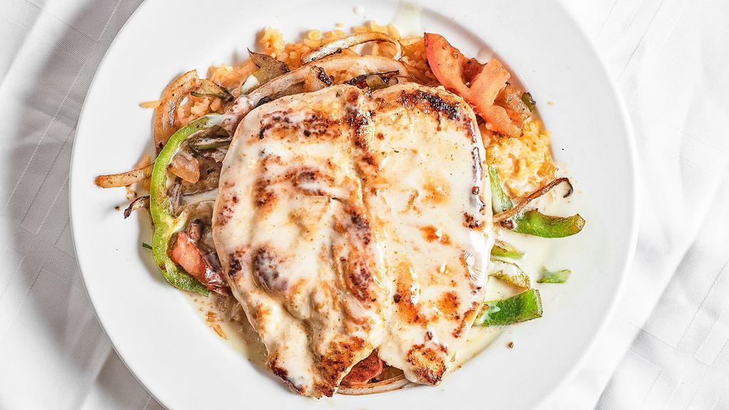 Pollo Loco · Grilled chicken breast with grilled onions, peppers, and tomatoes served on a bed of rice and covered in cheese sauce