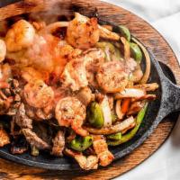 La Parrilla Fajitas · Grilled onions, bell peppers, tomatoes, chicken, steak, and
shrimp. Served with rice & beans...