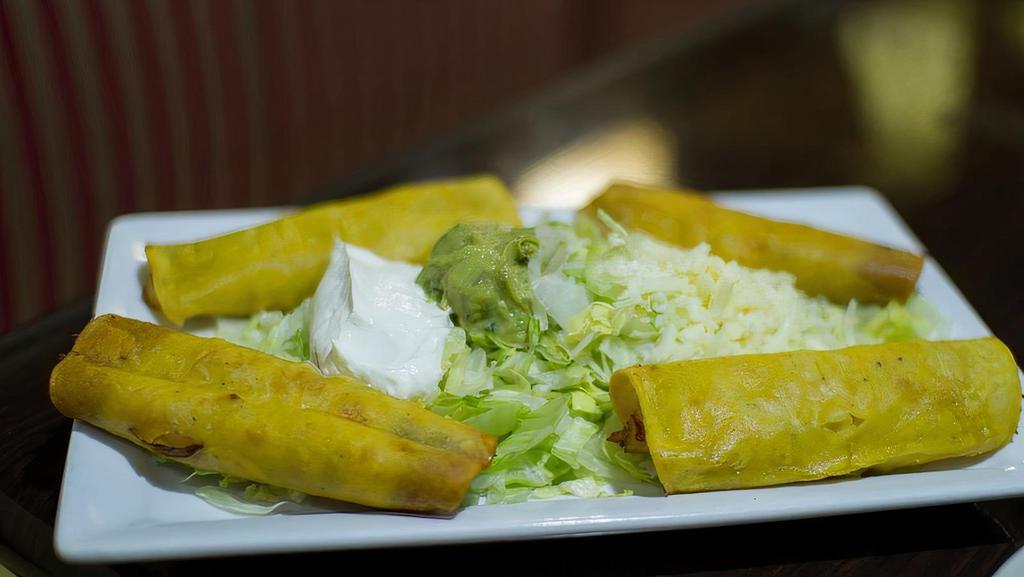 Mexican Flautas · Four (4) fried rolled taquitos with shredded chicken or ground beef. Served with lettuce, sour cream, and guacamole.