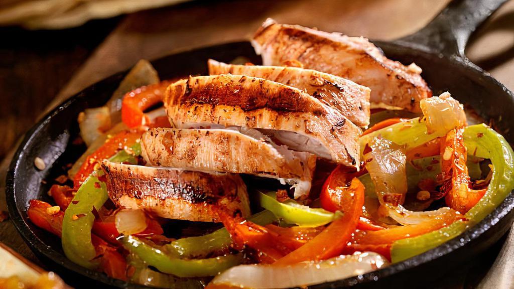 Chicken Fajitas · Grilled onions, bell peppers, tomatoes, and chicken. Served
with rice & beans, lettuce, sour cream, guacamole, pico de gallo,
and tortillas.