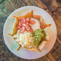 Taco Salad · Flour tortilla bowl with cheese sauce, lettuce, tomato, shredded cheese, sour cream or guaca...