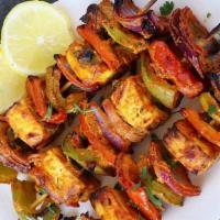 Paneer Tikka · Paneer tikka is an Indian dish made from chunks of paneer marinated in spices and grilled in...