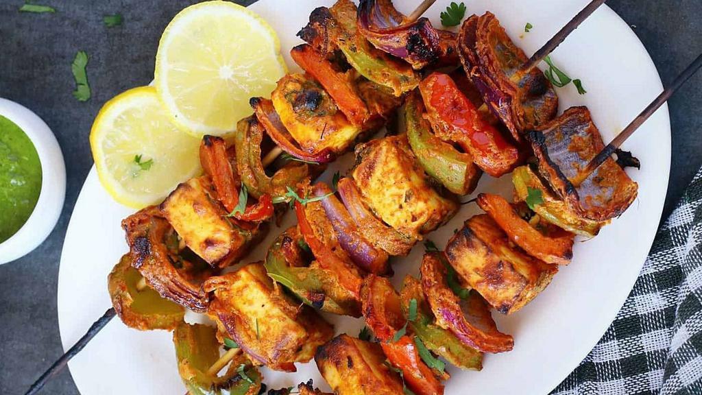 Paneer Tikka · Paneer tikka is an Indian dish made from chunks of paneer marinated in spices and grilled in a tandoor.