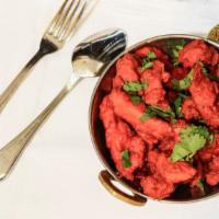 555 - Chicken · Long slices of chicken red chilies, onion, garlic and cashew nuts all pan-fried in a curry b...