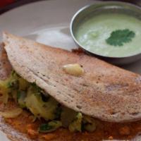 Mysore Masala Dosa · Thin rice crepe with a layer of hot chutney filled with potatoes and onions.