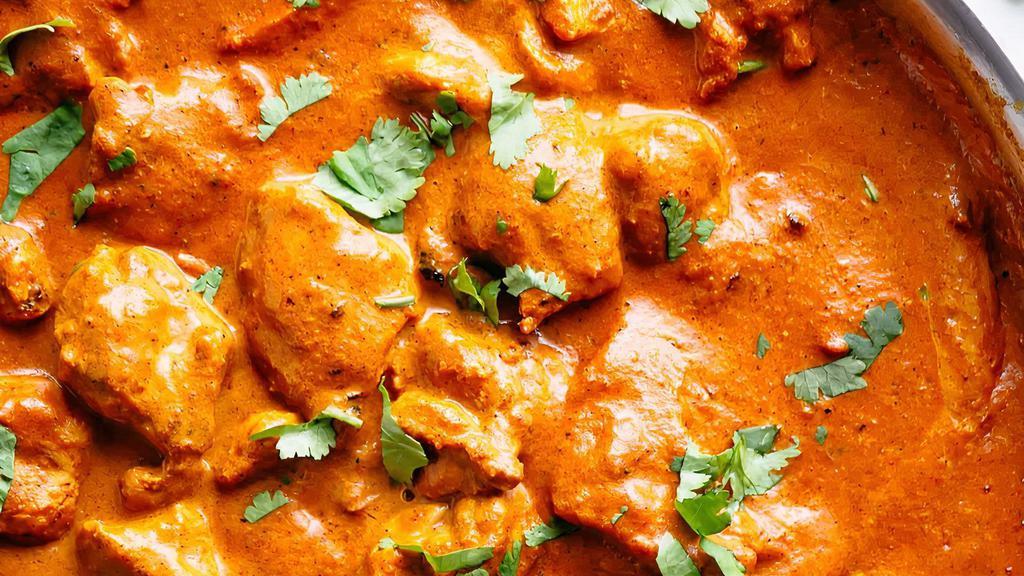 Chicken Tikka Masala · Tender boneless pieces of chicken broiled in the tandoor, then cooked in rich tomato, onion, and cream sauce.