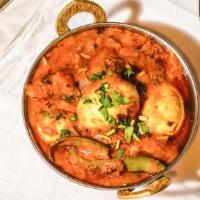 Egg Curry · Boiled egg's cooked in freshly ground spices with onions and tomato gravy.