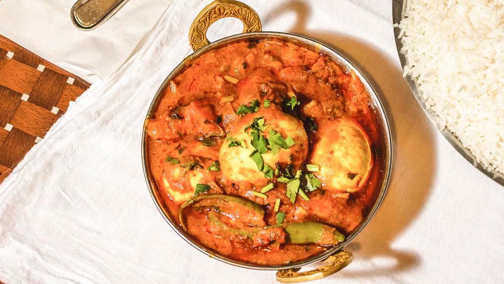 Egg Curry · Boiled egg's cooked in freshly ground spices with onions and tomato gravy.