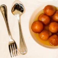 Gulab Jamun · Soft cottage cheese balls dipped in sugar syrup.