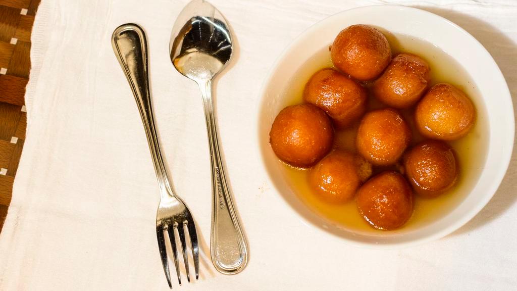 Gulab Jamun · Soft cottage cheese balls dipped in sugar syrup.