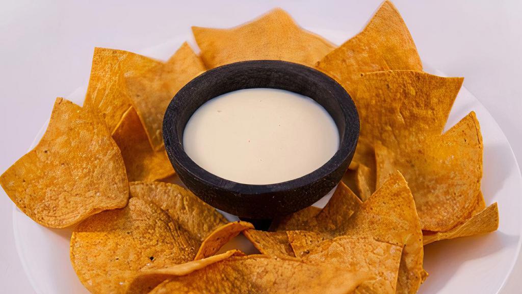 Cheese Dip · Our famous cheese blend 8oz served with a large bag of chips