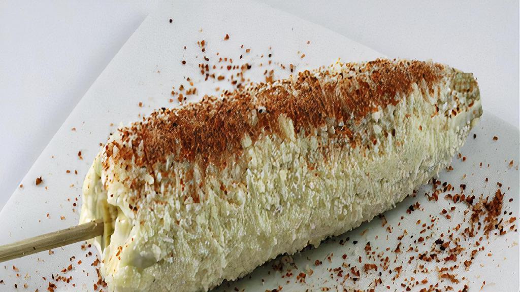 Elote Loco · A corn steamed to perfection and covered with a thin layer of mayonnaise, cheese and chili powder.