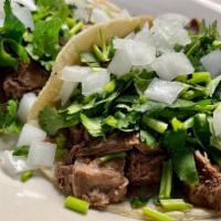 Taco Lengua / Beef Tongue · Loaded: lettuce, tomatoes, cheese and sour cream.