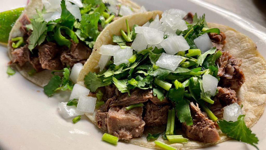 Taco Lengua / Beef Tongue · Loaded: lettuce, tomatoes, cheese and sour cream.