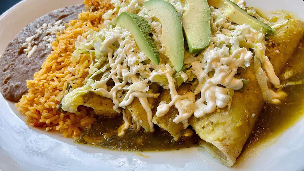 Enchiladas Verdes O Rojas · Four green or red enchiladas dipped in salsa and stuffed with shredded chicken and topped with lettuce, sour cream, queso fresco and avocado slices with a side of rice and refried pinto beans.