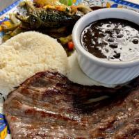 Cecina Mexicana · Salted grill steak served with white rice, black beans,
nopales, pico de gallo and tortillas