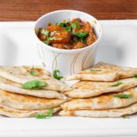 Naan Bread With Curry Chicken · 3 pieces of onion flavored naan bread (flatbread) served with side of freshly cooked curry c...