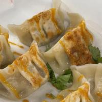 Pan-Fried Dumplings (6Pcs) · Pan-fried dumplings of your choice served with barbecue tangy sauce and soy sauce.