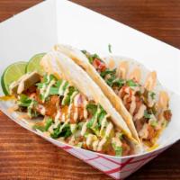 Asian Tacos (2Pcs) · Flour tortillas with Asian style spiced chicken topped with pickled jalapeños, tangy pico de...