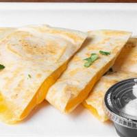 Kids Cheese Quesadillas · 10” Flour tortilla heated to a crisp on the griddle with cheese.