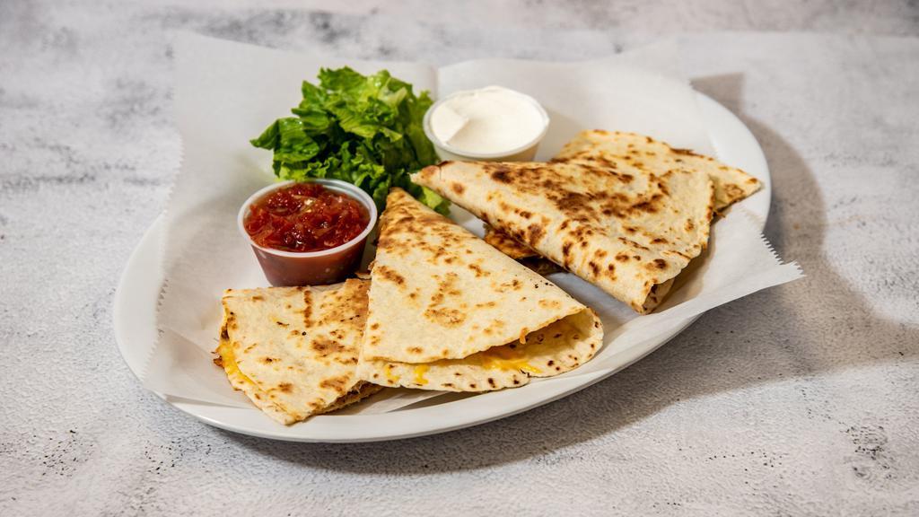 Chicken Quesadilla · Grilled chicken, onions, and peppers in a grilled tortilla with melted Cheddar Jack cheese. Served with lettuce, sour cream, and salsa.