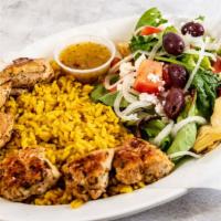 Kabobs · Two seasoned and grilled kabobs served with a side Mediterranean salad and rice.