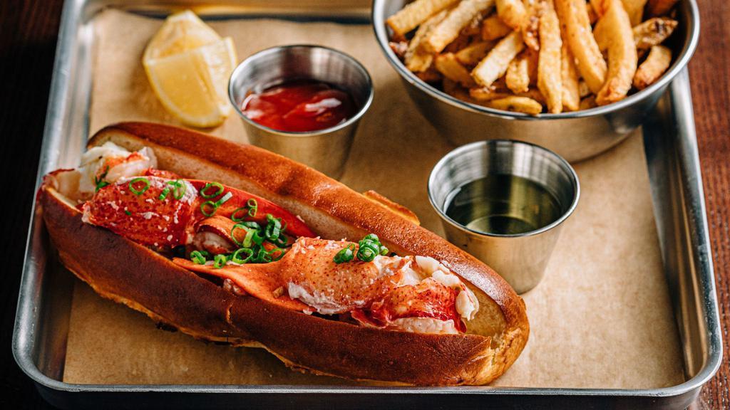 Lobster Roll · Tail and claw meat from a whole (1.25 pounds to 1.5 pounds) fresh maine lobster, New England brioche roll, clarified butter served with hand-cut fries.