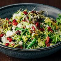 Brussels Sprouts & Mixed Greens Salad · Sliced Brussels, mixed greens, tomato, avocado, dried cranberries, toasted walnuts, pomegran...