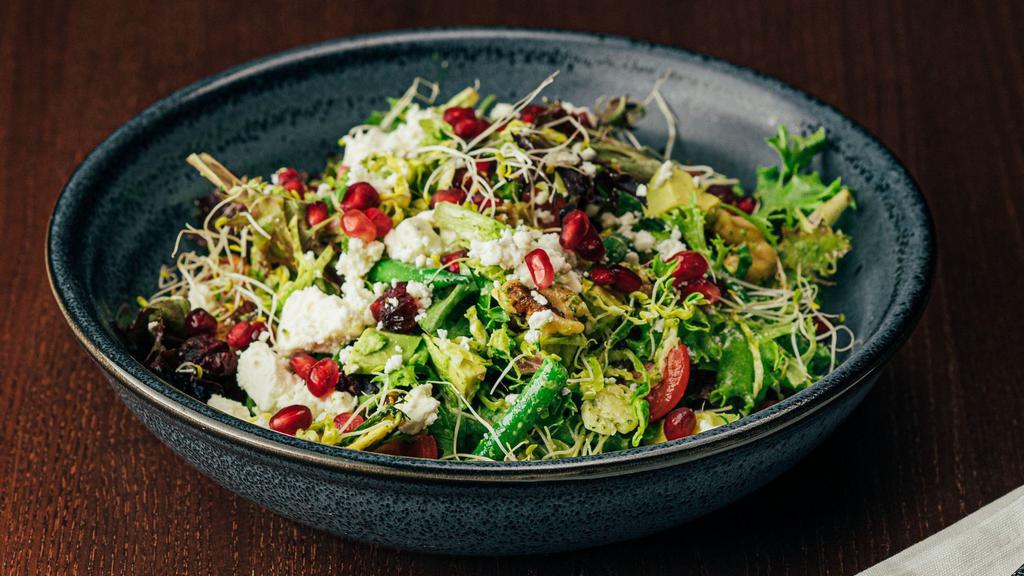Brussels Sprouts & Mixed Greens Salad · Sliced Brussels, mixed greens, tomato, avocado, dried cranberries, toasted walnuts, pomegranate seeds, feta, green goddess.