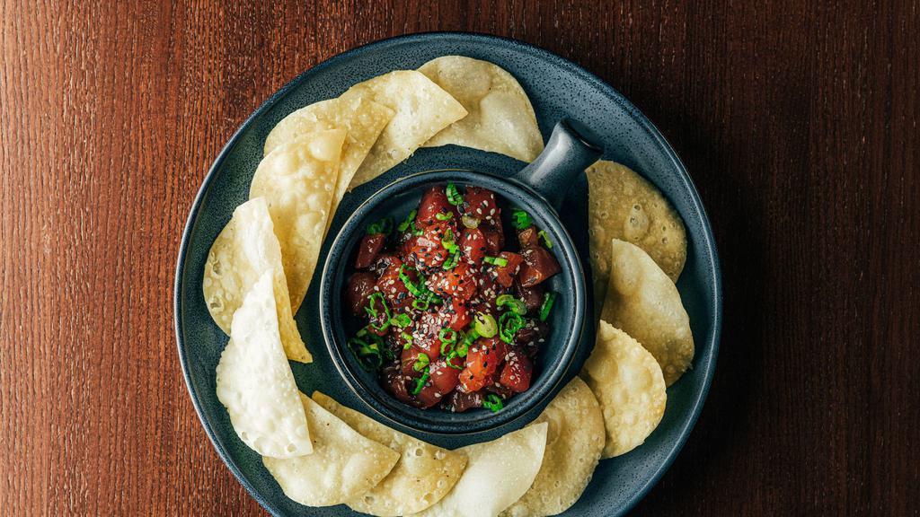 Ahi Tuna Poke · #1 grade ahi tuna, house-made poke sauce, lime zest, side wonton crisps.

These items may be served under-cooked. Consuming raw or under-cooked meats, poultry, seafood, shellfish, eggs or unpasteurized milk may increase your risk of food-borne illness.