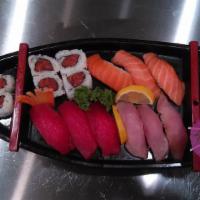 Sushi Deluxe · 9 Pcs Sushi or Sashimi ( Chef's Choice with Spicy Tuna Roll ( Served with miso soup or salad)