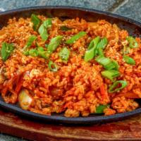 Kimchi Fried Rice · Spicy. Stir fry carrots, kimchi, onions, bell peppers, mushrooms, egg, and rice. Topped with...