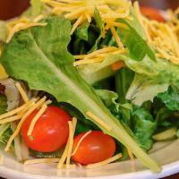 House Salad · Romaine lettuce, spring mix blend, tomatoes, cucumbers, sweet peppers, red onions, topped wi...