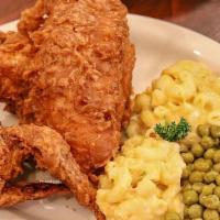 Family Meal* · Twelve pieces of  fried chicken  with four sides and  four cornbread.