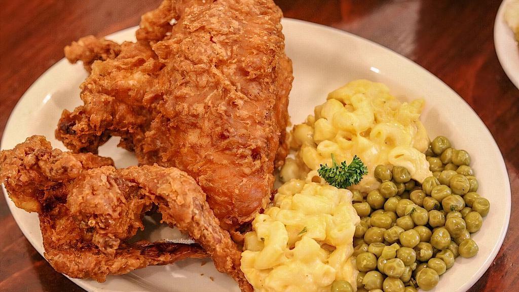 Family Meal* · Twelve pieces of  fried chicken  with four sides and  four cornbread.