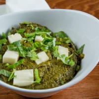 Palak Paneer (Allo Palak) · Fresh spinach cooked with homemade cheese delicately spiced.