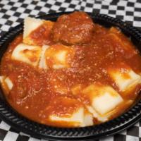 Ravioli · Ravioli stuffed with ricotta cheese with our homemade red sauce, a meatball and a piece of g...