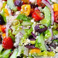Greek Salad · Mixed lettuce with feta cheese, onions, freshly grated cheddar, sun dried tomatoes, black ol...