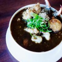 Cup Hot Gulf Seafood Gumbo · Fantastic Dark and Rich Roux dressed with House-Made Crawfish Hushpuppy, Green Onion, and Wh...