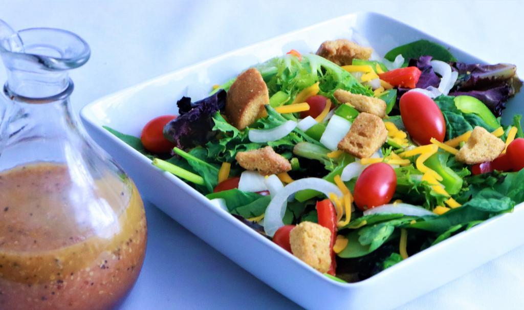 Garden Salad · Fresh spring mix salad made with your choice of crisp veggies. Add air-fried chicken breast or tender ribeye strips.