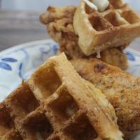 Chicken And Waffles · Air-Fried chicken strips and fluffy Belgian waffles with maple
syrup for dipping, a side, an...