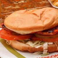 #11 Smoke Sausage Sandwich · Smoked sausage, lettuce, tomatoes, pickles, mayonnaise, and basted with our own hickory-smok...
