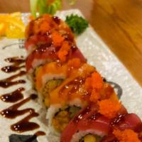 Hurricane Roll · Spicy crawfish and cucumber inside, topped with sliced tuna, salmon and tobiko served with p...