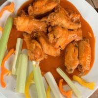 Wings · Fried wings served in one of our savory sauces.