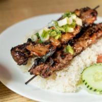 Com Dac Biêt · Grilled pork, chicken and beef. Served with rice, lettuce, slices of fresh tomato, cucumber,...