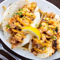 Shrimp Tacos · Served with French fries.