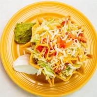 Taco Salad · Beef or chicken Crispy flour shell filled with beans, lettuce, tomato, cheese, sour cream, g...