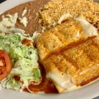 Chimichanga · (Soft or fried) Two flour tortillas filled with chicken or beef. Served with rice, beans, to...